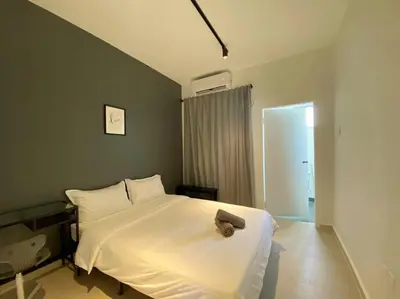 a bedroom with a white bed in a room at IKEA Modernism House 10Pax`Near Icon City in Bukit Mertajam