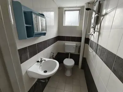 a small bathroom with a sink and a toilet at City View Apartment in Ipoh