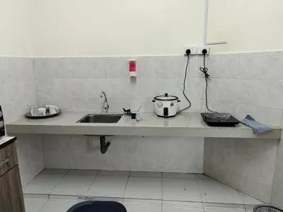 a kitchen counter with a sink and a toaster at City View Apartment in Ipoh