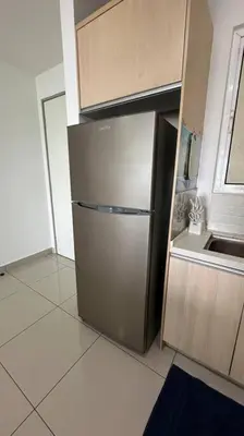 a kitchen with a stainless steel refrigerator in a room at Southbay Seaview Condo A10 10minQueensbay 10minSpice in Bayan Lepas