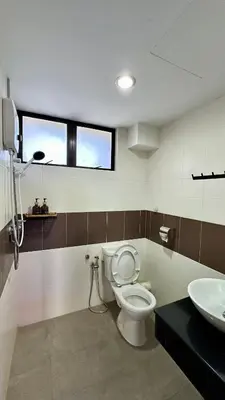 a bathroom with a toilet and a sink at Pengo Homestay Georgetown in George Town