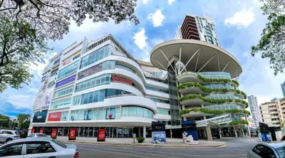 a large building with a funnel in a city at Pengo Homestay Georgetown in George Town