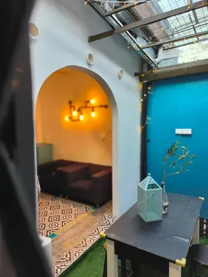 a living room with a couch and a table at Getaway Hometsay Neaby Beach batu Ferringghi 4BR for 15px in Tanjung Bungah