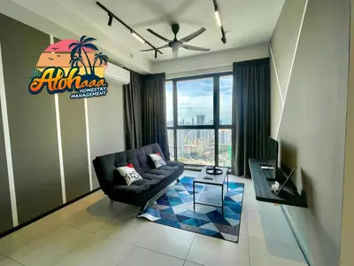 a living room with a couch and a tv at Industrial Style 2 Bedroom Unit Urban Suites Georgetown Sea View Jelutong in Jelutong