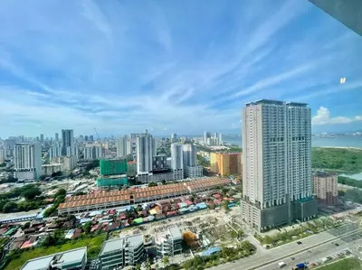 an aerial view of a city with tall buildings at Industrial Style 2 Bedroom Unit Urban Suites Georgetown Sea View Jelutong in Jelutong