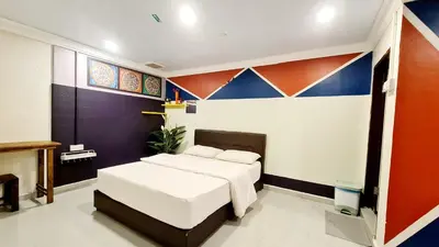 a bedroom with a bed in a room at Pine Lodge BY EVR Previously YSS indrawasih in Perai