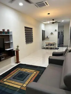 a living room with a couch and a table at SKV Homestay in Teluk Intan