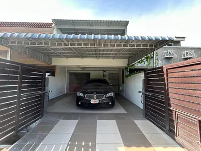 a car parked inside of a garage with a car parked at Ipoh Comfortable Family Homestay 4R3B 12pax SY25 in Ipoh