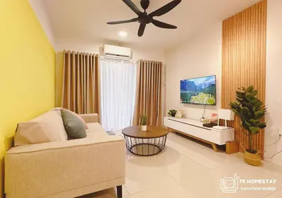 a living room with a couch and a ceiling fan at FE Cozy Ipoh Homestay Manhattan Condominium Ipoh Waterpark 3BR 8 pax by FE Homestay \u6021\u4fdd\u6c11\u5bbf \u6c34\u4e0a\u4e50\u56ed in Ipoh