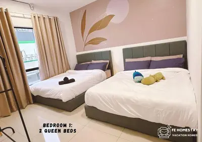a bedroom with two beds with stuffed animals on them at FE Cozy Ipoh Homestay Manhattan Condominium Ipoh Waterpark 3BR 8 pax by FE Homestay \u6021\u4fdd\u6c11\u5bbf \u6c34\u4e0a\u4e50\u56ed in Ipoh
