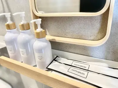 three bottles of soap on a shelf in a room at Urban Suites #Soft creamy #Infinity Pool #local neighbourhood #4pax #2BR 2bath #2Queen #Quality well maintained #Private host in Jelutong