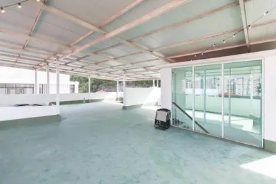an empty building with a large room with windows at Tanjung Bungah 5BR Villa w pool 20pax in Tanjung Bungah