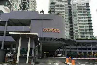 a building with a sign on it in front of tall buildings at Sekinchan Fragrance \u82ac\u82b3\u6c11\u5bbf in Sekincan