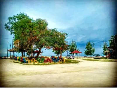 a playground with colorful play equipment in a park at Sekinchan Fragrance \u82ac\u82b3\u6c11\u5bbf in Sekincan