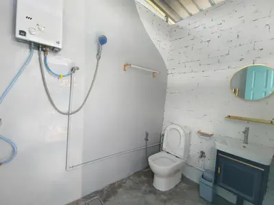 a bathroom with a toilet and a shower at The Starry Dome Couple Room in Cameron Highlands