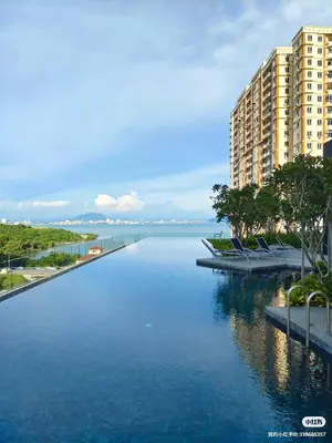 a large body of water with buildings in the background at Urban Suites TWO Or THREE Bedroom Georgetown by Annesui Cottage in Jelutong