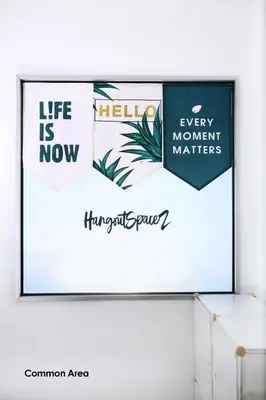 a screen with a sign that reads life is now and every moment matters at HangoutSpacez Queensbay at Bayan Lepas Penang in Bayan Lepas