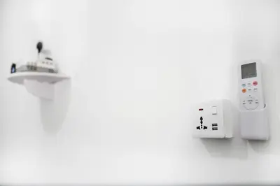 a room with a wii controller and a microwave at HangoutSpacez Queensbay at Bayan Lepas Penang in Bayan Lepas