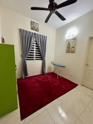 a room with a red rug in a room with a ceiling fan at ADZ Islam Homestay Simpang Pulai in Kampong Kepayang