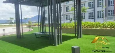 a playground in front of a building with a slide at Anderson Suite by Hopestay Property Management in Ipoh