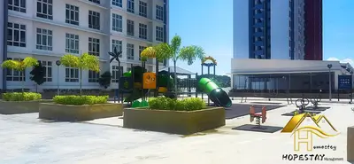a playground in a park in front of a building at Anderson Suite by Hopestay Property Management in Ipoh