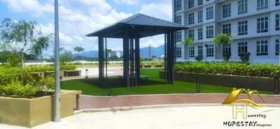 a gazebo in a park in front of a building at Anderson Suite by Hopestay Property Management in Ipoh