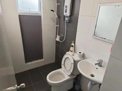 a small bathroom with a toilet and a sink at SweetHome Brinchang Pent House - Pasar Malam area in Brinchang