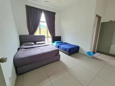 a bedroom with a bed and a window at SweetHome Brinchang Pent House - Pasar Malam area in Brinchang