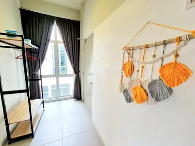 a room with a wall withanas hanging on it at SweetHome Brinchang Pent House - Pasar Malam area in Brinchang
