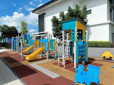 a playground with a slide in front of a building at Sunway Onsen Suite Cozy Homestay in Ipoh