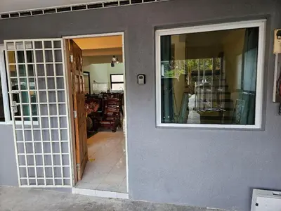 an open door of a house with a door at Highlands Double Story House in Tanah Rata