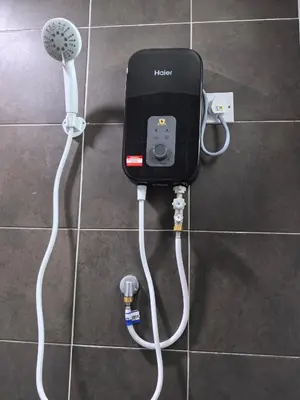 a wii controller plugged into a wall in a bathroom at Sweet Homestay Meritus by Moowin in Perai