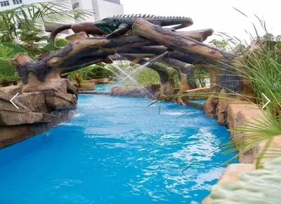 a water slide in a pool at a resort at Sweet Homestay Meritus by Moowin in Perai