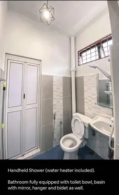 a bathroom with a toilet and a sink at Pillow Talk 3 Hours Room in Bukit Mertajam