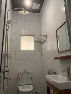 a bathroom with a toilet and a sink at Pillow Talk 3 Hours Room in Bukit Mertajam