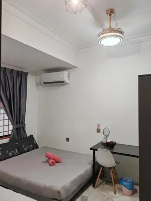 a small bedroom with a bed and a desk at Pillow Talk 3 Hours Room in Bukit Mertajam