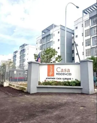 a building with a sign in front of some buildings at Ipoh Apartment Casa Klebang 31200 Chemor Ipoh in Chemor