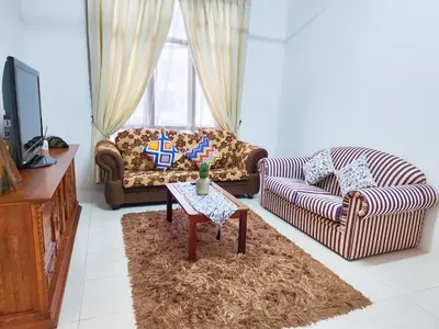a living room with two couches and a table at Ipoh Apartment Casa Klebang 31200 Chemor Ipoh in Chemor