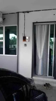 a room with a window with a curtain at Bota TheDaun Homestay Taman Indera in Kampung Bota Kiri