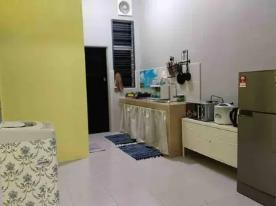 a kitchen with a sink and a counter in a room at Bota TheDaun Homestay Taman Indera in Kampung Bota Kiri