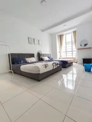 a large white room with two beds in it at Irdina HomestayMuslim's at Emerald Avenue Brinchang Centrum in Brinchang