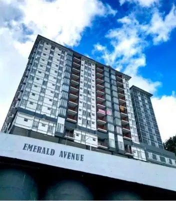 a tall apartment building with the words emerald avenue at Irdina HomestayMuslim's at Emerald Avenue Brinchang Centrum in Brinchang