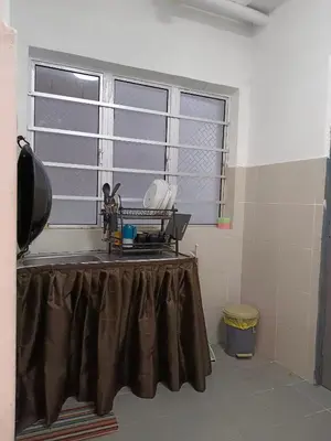 a room with a table in front of a window at Irdina HomestayMuslim's at Emerald Avenue Brinchang Centrum in Brinchang