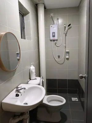 a bathroom with a toilet and a sink and a shower at Irdina HomestayMuslim's at Emerald Avenue Brinchang Centrum in Brinchang