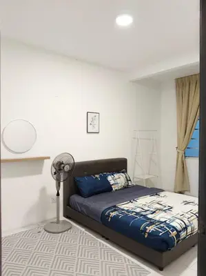 a bedroom with a bed and a fan in it at Irdina HomestayMuslim's at Emerald Avenue Brinchang Centrum in Brinchang