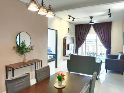 a dining room and living room with a table and chairs at Irdina HomestayMuslim's at Emerald Avenue Brinchang Centrum in Brinchang