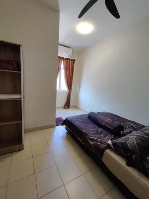 a bedroom with a bed and a window at Homestay Adleya in Bagan Serai