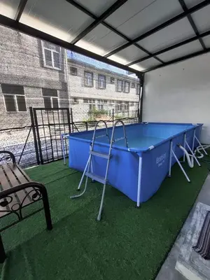 a large blue ping pong table in a building at Homestay Adleya in Bagan Serai