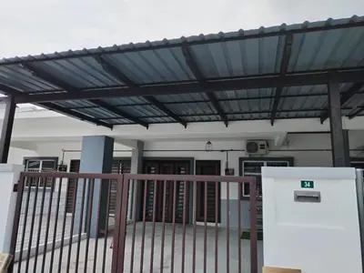 a building with awning over the entrance to a building at Orked Homestay Seri Iskandar in Seri Iskandar