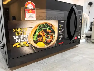 a microwave with a picture of a bowl of food in it at Sky Suite Meritus Residence in Perai in Perai